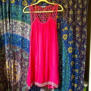 Airy bright pink satin summer party dress with crochet straps and sequins.